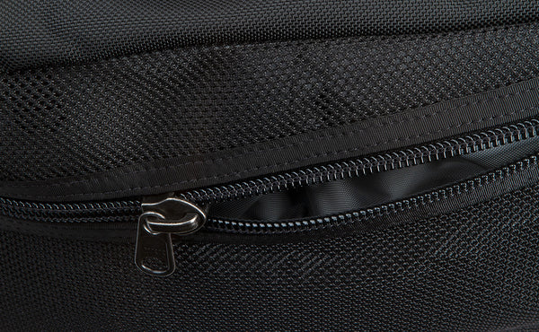 An close shot of the zipper on the mesh side compartment of the Road Buddy Duffel 60.